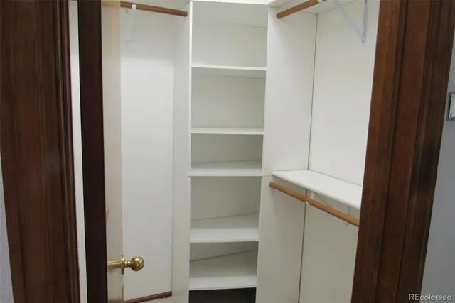 a view of an empty walk in closet