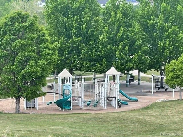 a front view of a house with a yard table and chairs