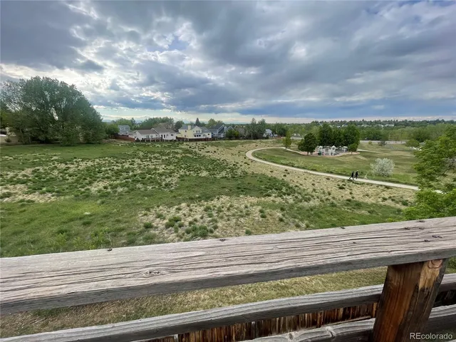 a view of a yard from a balcony