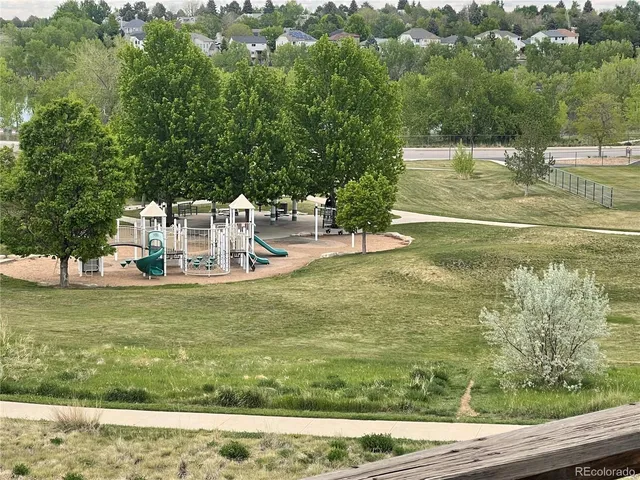 a view of a swimming pool with a yard
