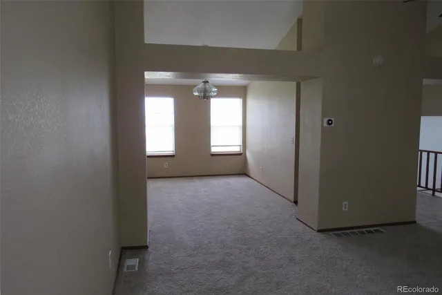 a view of empty room with windows