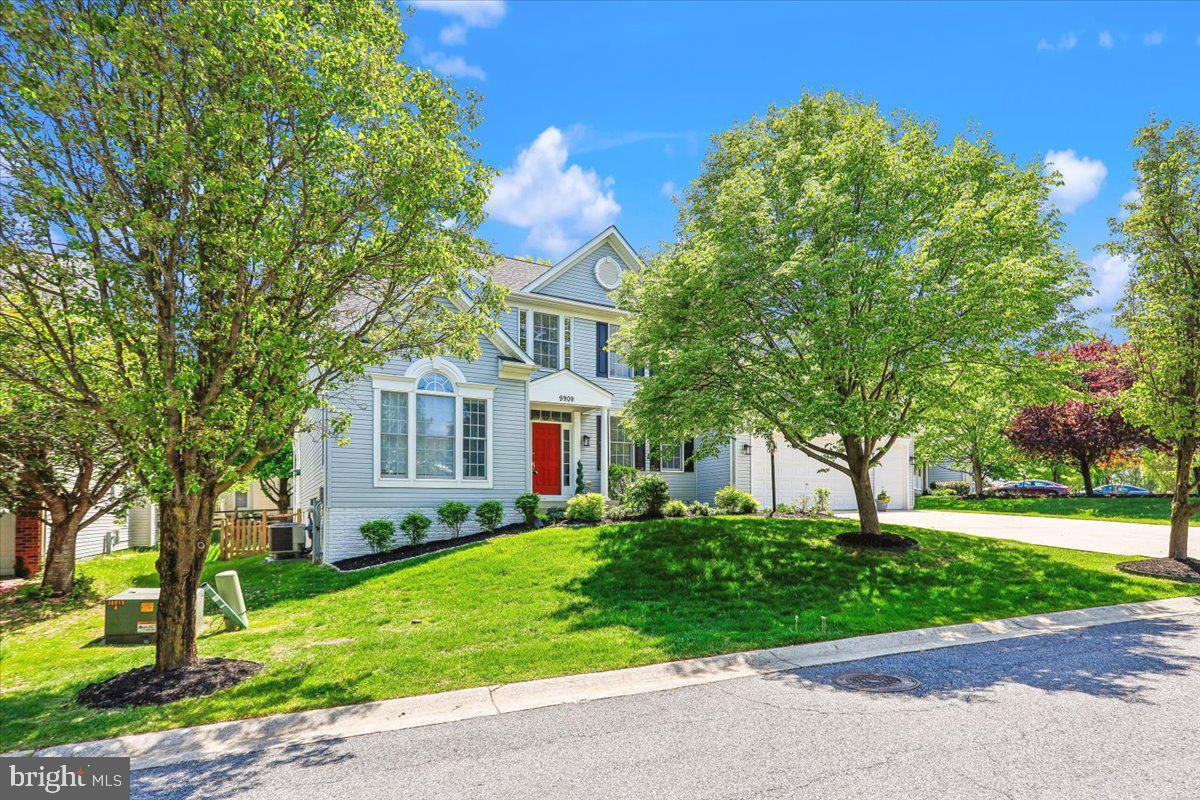 9909 Midsummer Snow Lane Laurel, MD 20723 - Photo 1 of 81 a front view of a house with a garden