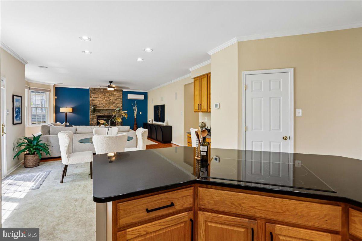 9909 Midsummer Snow Lane Laurel, MD 20723 - Photo 17 of 81 a view of a kitchen with kitchen island a counter top space a sink stainless steel appliances and cabinets