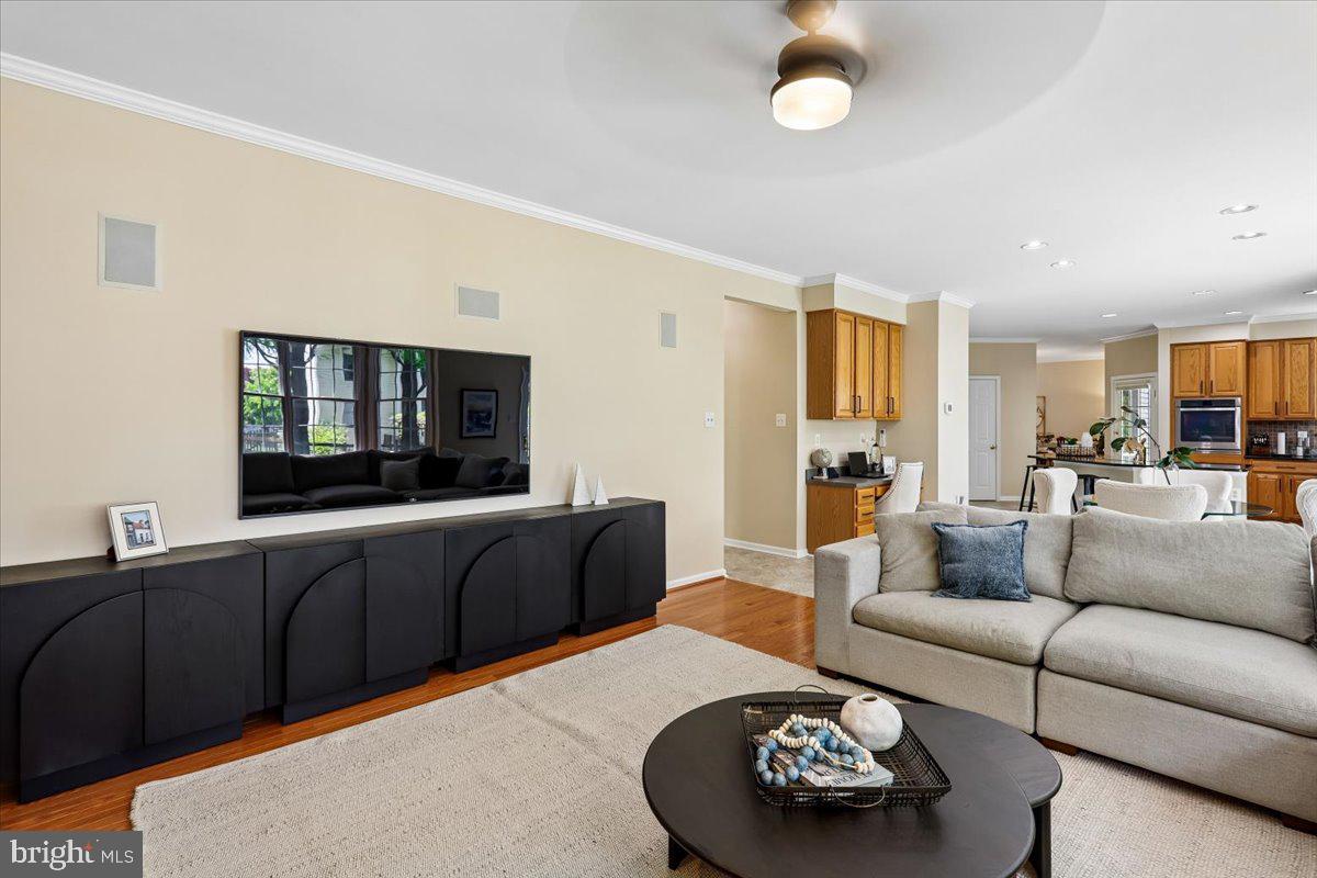 9909 Midsummer Snow Lane Laurel, MD 20723 - Photo 20 of 81 a living room with furniture and a flat screen tv