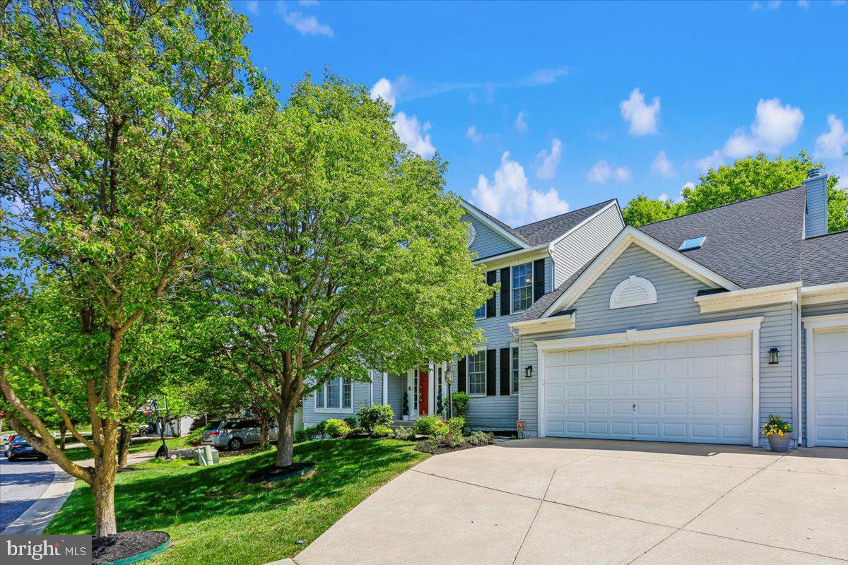 9909 Midsummer Snow Lane Laurel, MD 20723 - Photo 2 of 81 a front view of a house with a garden