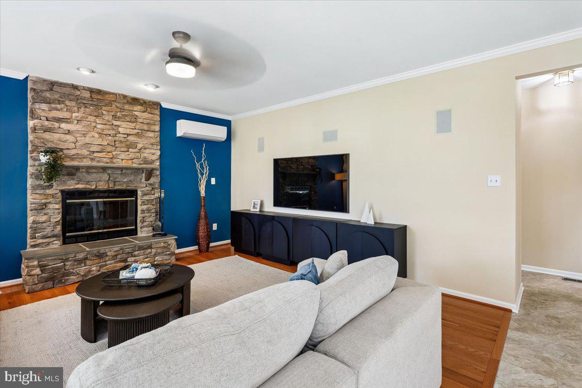 9909 Midsummer Snow Lane Laurel, MD 20723 - Photo 21 of 81 a living room with furniture and a fireplace