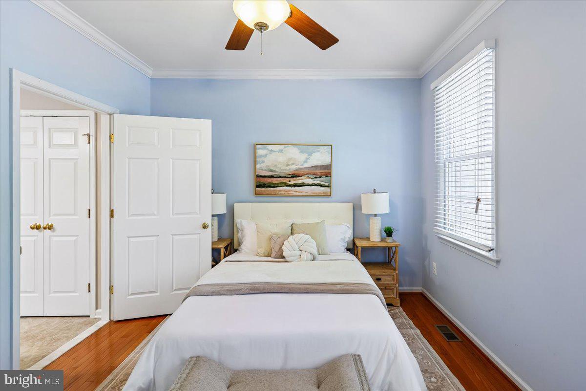 9909 Midsummer Snow Lane Laurel, MD 20723 - Photo 22 of 81 a bedroom with a bed and a window