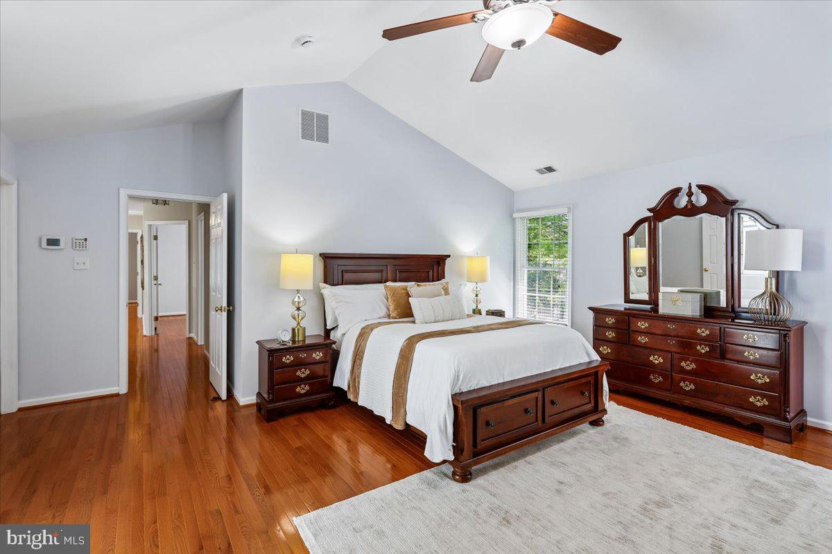 9909 Midsummer Snow Lane Laurel, MD 20723 - Photo 29 of 81 a bed room with a bed and a dresser