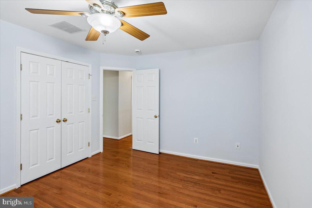 9909 Midsummer Snow Lane Laurel, MD 20723 - Photo 41 of 81 a view of empty room with wooden floor
