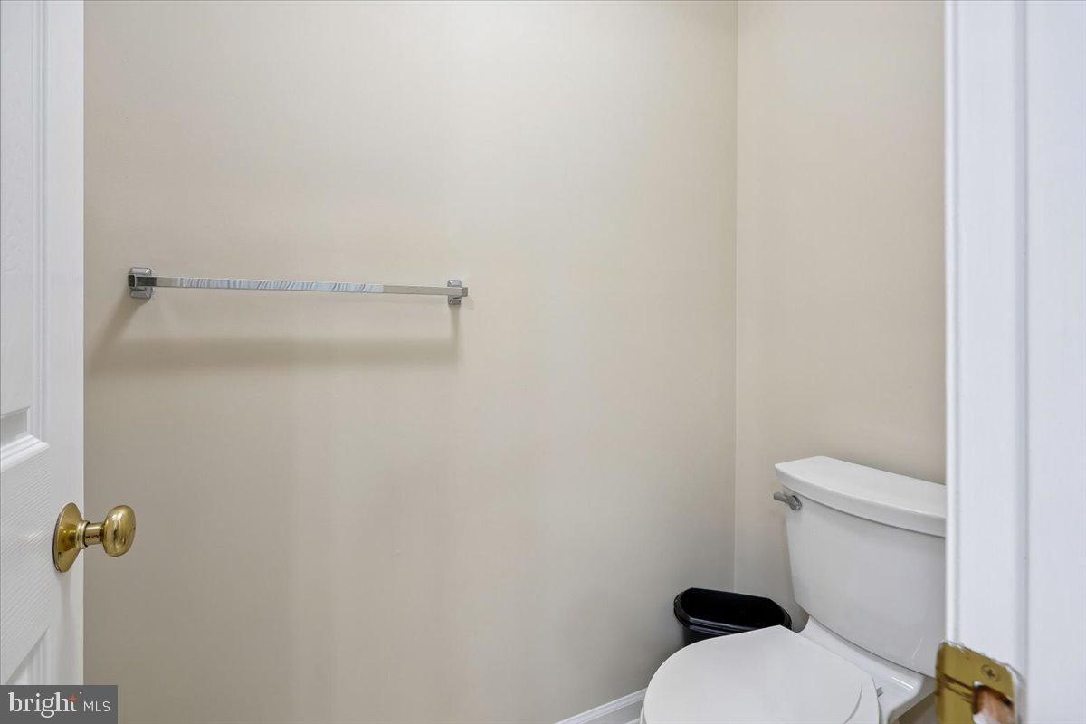 9909 Midsummer Snow Lane Laurel, MD 20723 - Photo 43 of 81 a white toilet sitting next to a shower