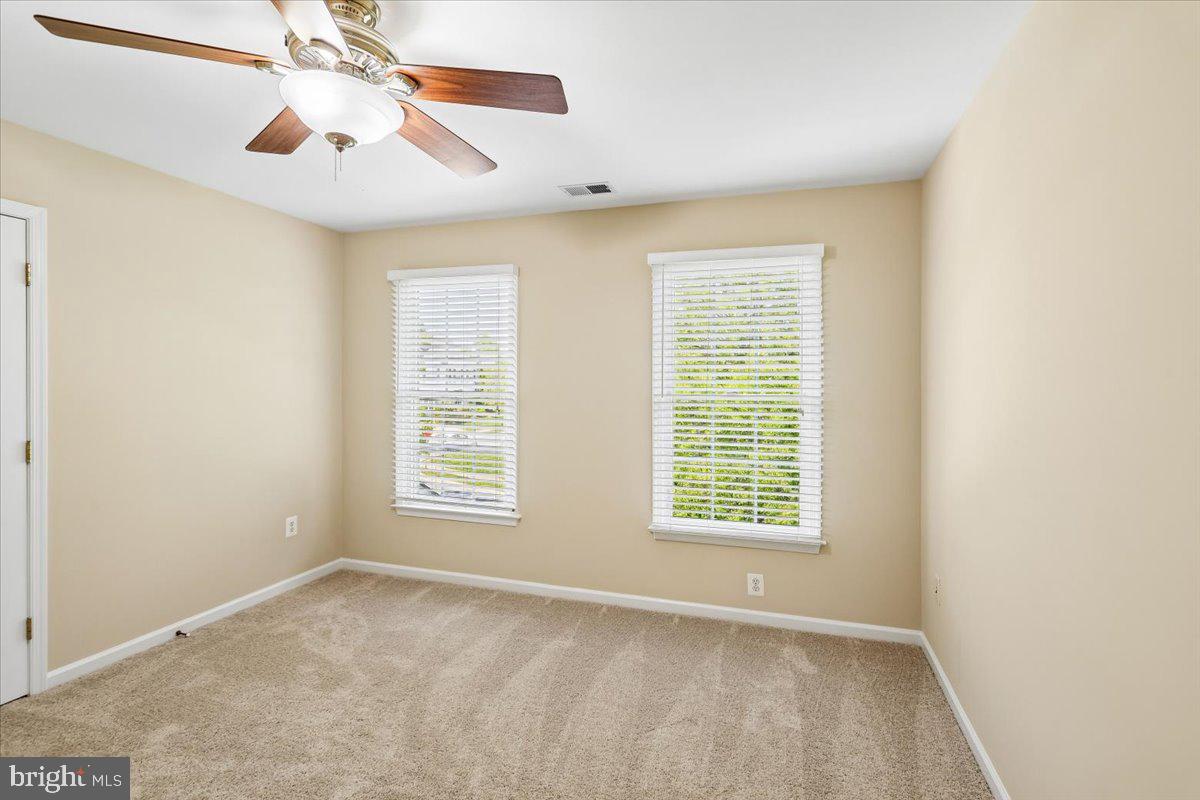 9909 Midsummer Snow Lane Laurel, MD 20723 - Photo 45 of 81 a view of an empty room with a window