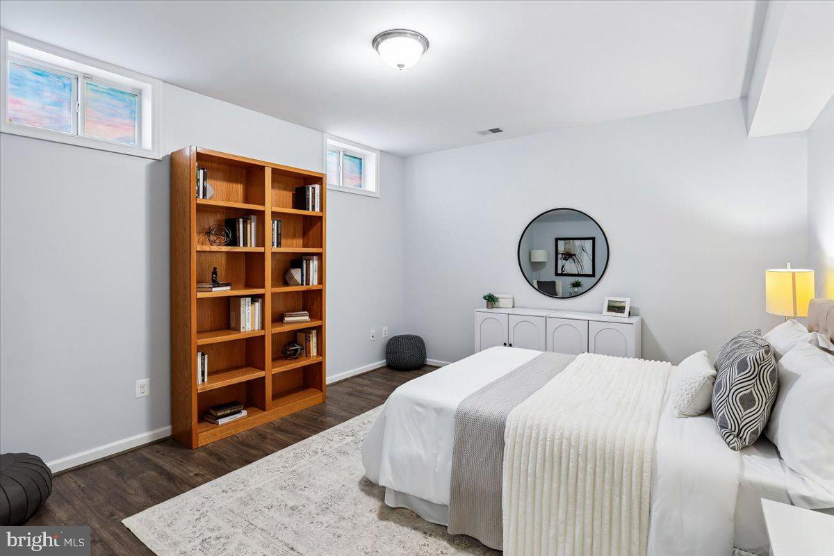 9909 Midsummer Snow Lane Laurel, MD 20723 - Photo 56 of 81 a bedroom with a bed and a cabinets