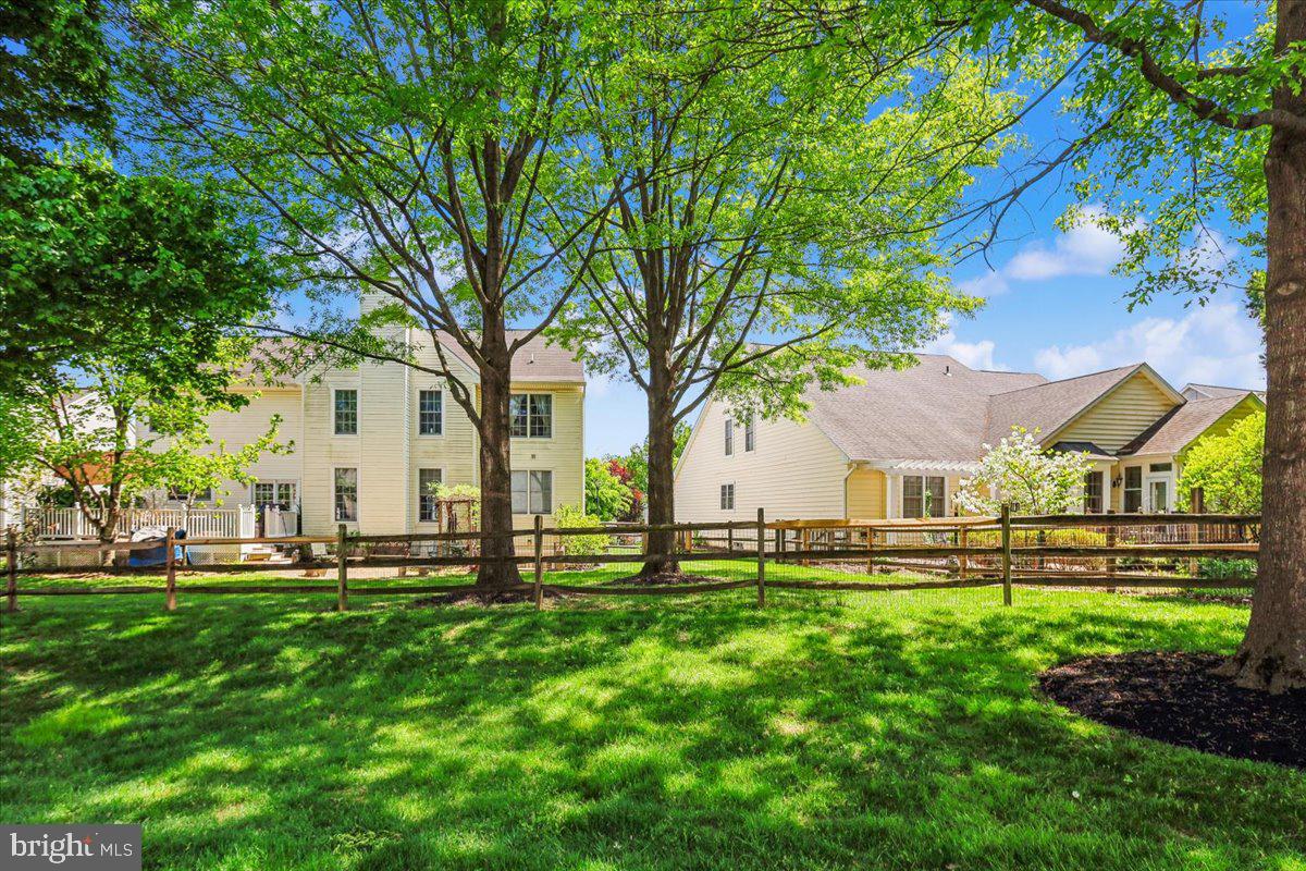 9909 Midsummer Snow Lane Laurel, MD 20723 - Photo 67 of 81 a front view of a house with a yard