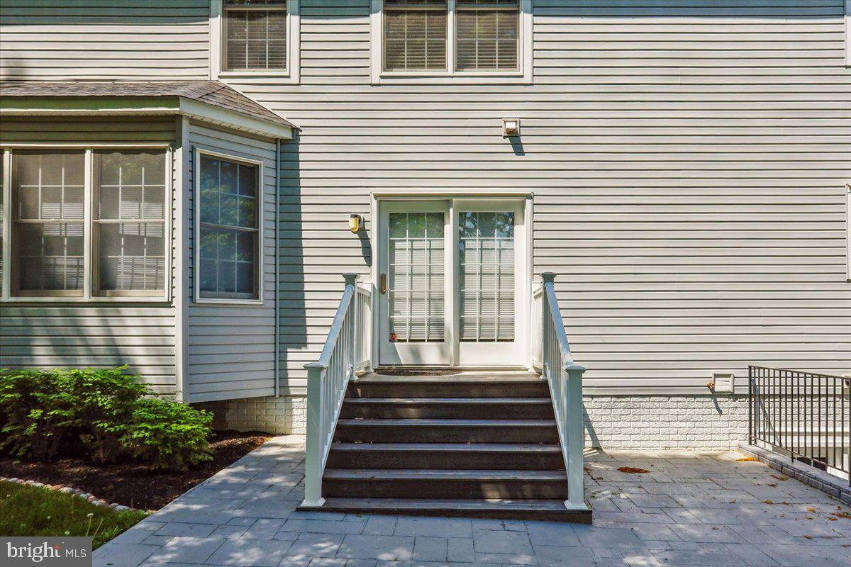 9909 Midsummer Snow Lane Laurel, MD 20723 - Photo 68 of 81 a front view of a house with a garden