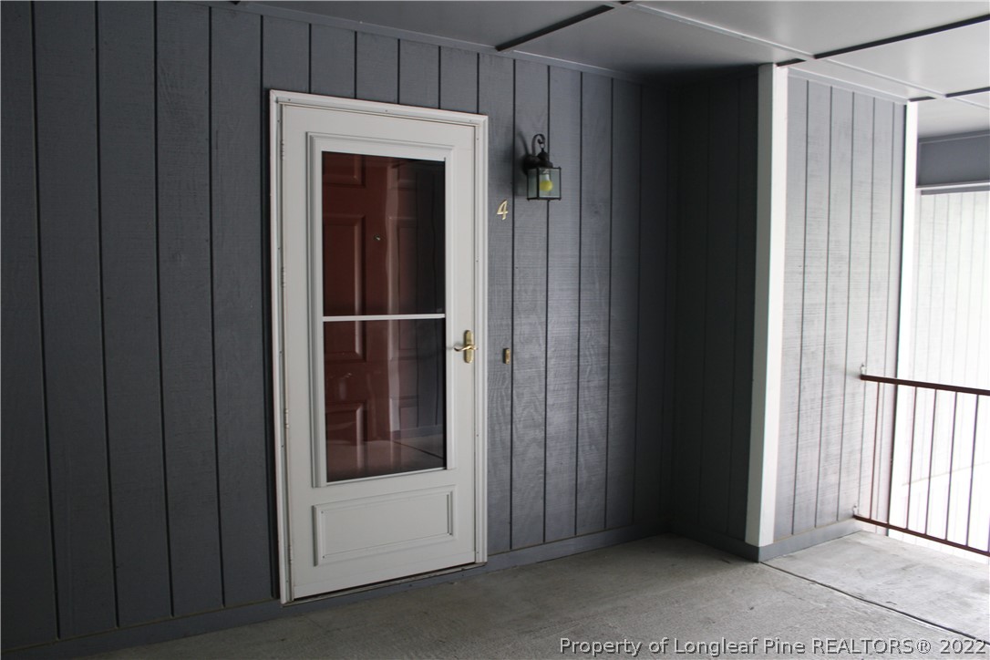 1925 Sardonyx Road, Unit 4 Fayetteville, NC 28303 - Photo 1 of 20 a view of a hallway with a cabinet and door