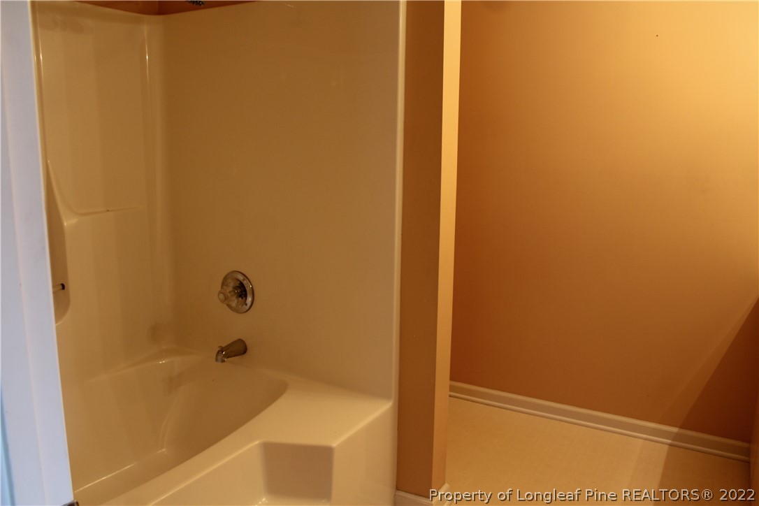 1925 Sardonyx Road, Unit 4 Fayetteville, NC 28303 - Photo 16 of 20 a bathroom with a tub