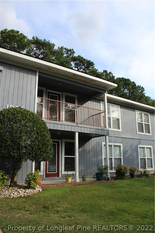 1925 Sardonyx Road, Unit 4 Fayetteville, NC 28303 - Photo 20 of 20 a view of a building with a yard
