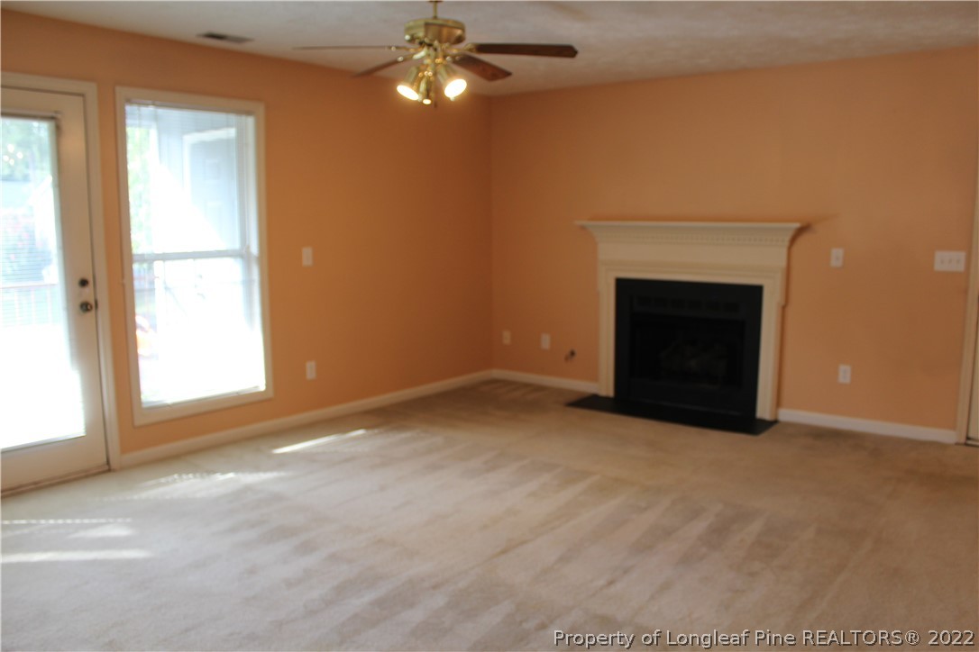 1925 Sardonyx Road, Unit 4 Fayetteville, NC 28303 - Photo 3 of 20 an empty room with windows and fireplace