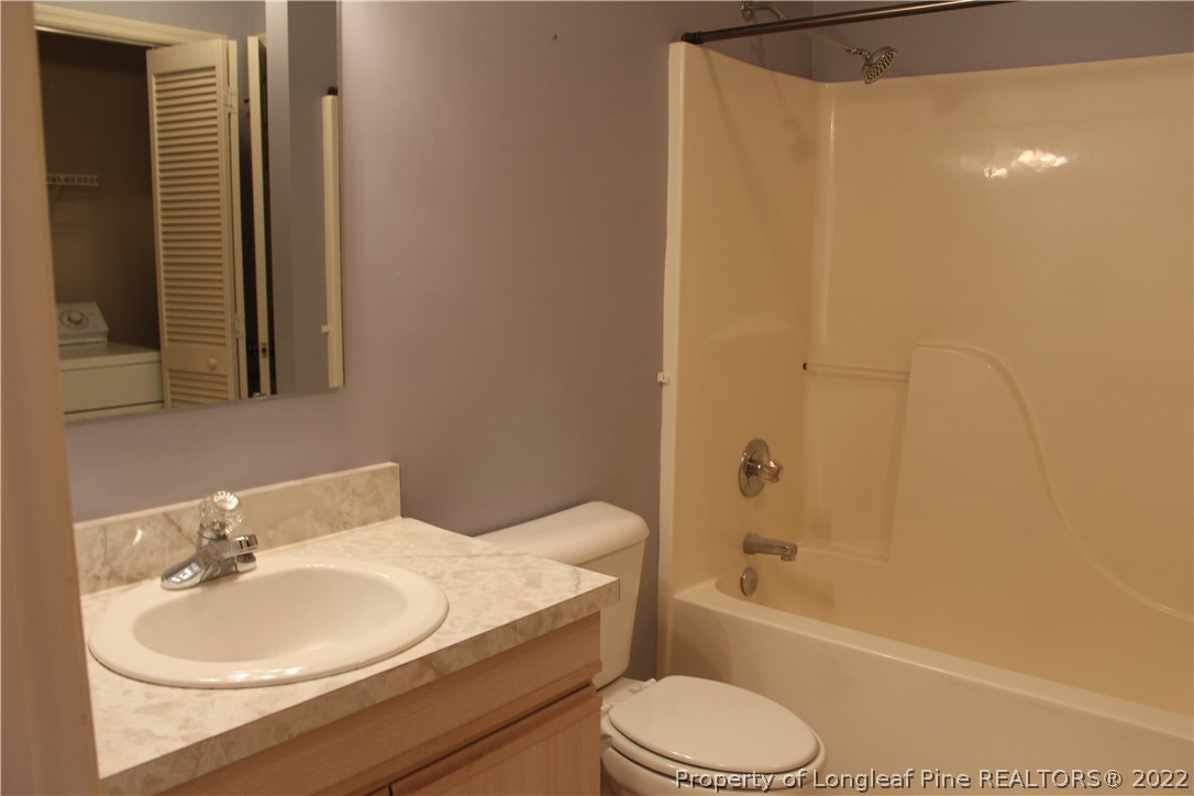 1925 Sardonyx Road, Unit 4 Fayetteville, NC 28303 - Photo 10 of 20 a bathroom with a sink toilet and shower
