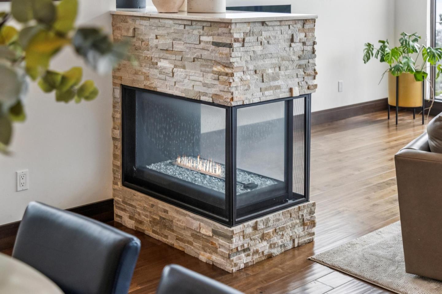 243 Del Monte Road El Granada, CA 94019 - Photo 14 of 66 a living room with a couch and a potted plant