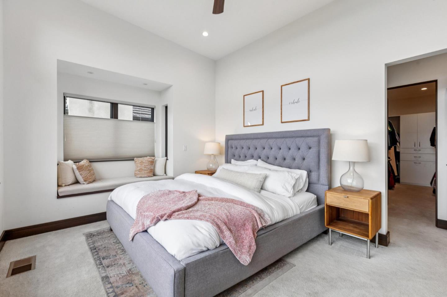 243 Del Monte Road El Granada, CA 94019 - Photo 27 of 66 a bedroom with a bed and lamp