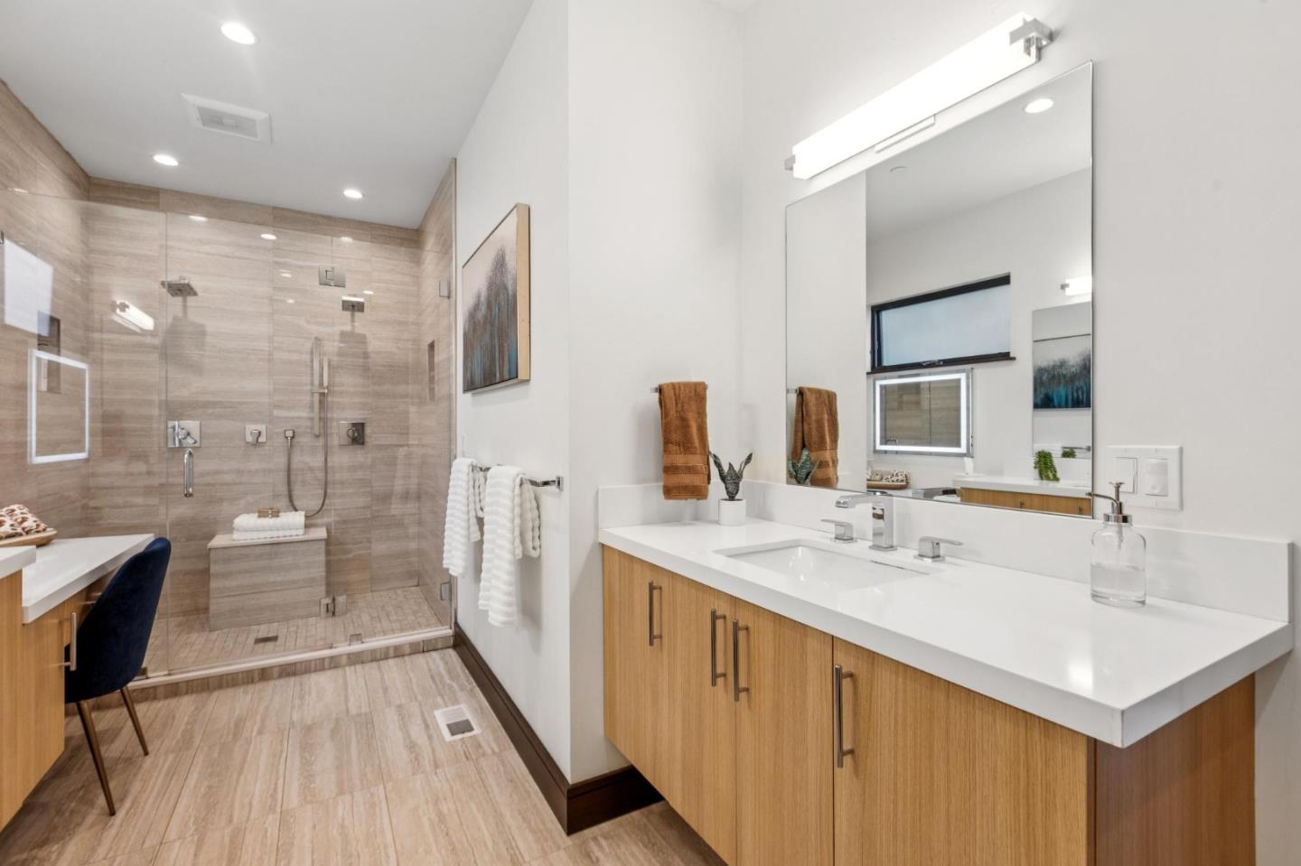 243 Del Monte Road El Granada, CA 94019 - Photo 29 of 66 a spacious bathroom with a double vanity sink a mirror and a shower