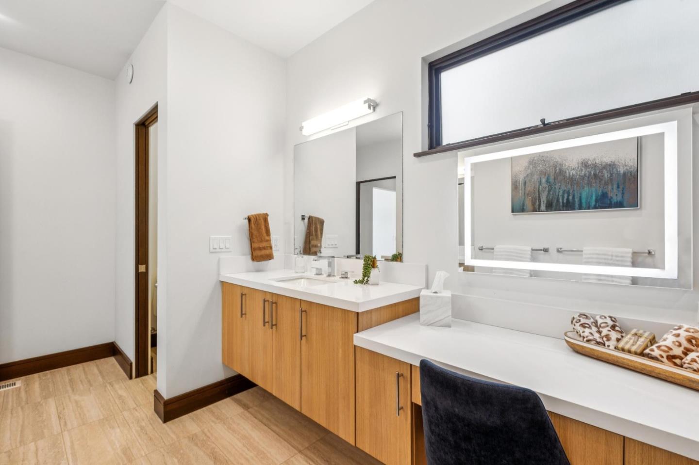 243 Del Monte Road El Granada, CA 94019 - Photo 30 of 66 a bathroom with a sink a mirror and a bathtub