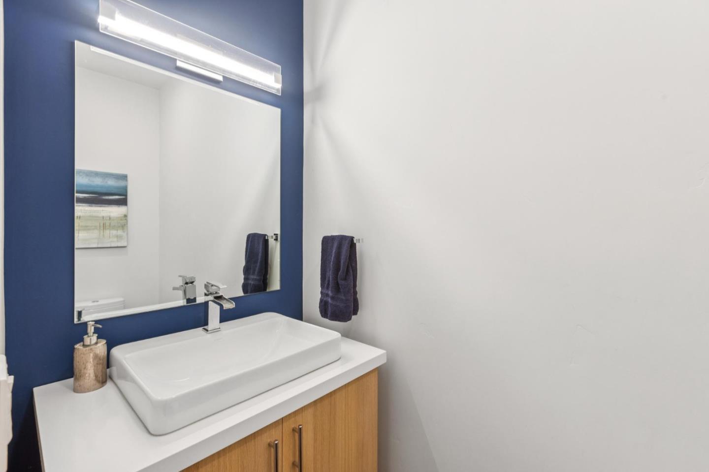 243 Del Monte Road El Granada, CA 94019 - Photo 33 of 66 a bathroom with a sink and a mirror
