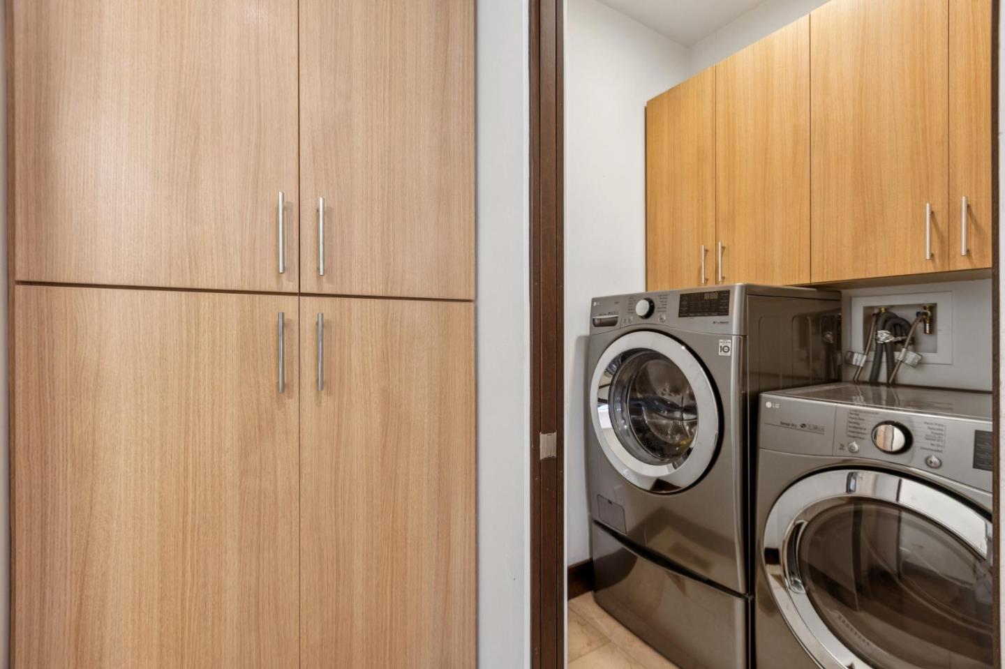 243 Del Monte Road El Granada, CA 94019 - Photo 34 of 66 a view of storage and utility room with washer and dryer