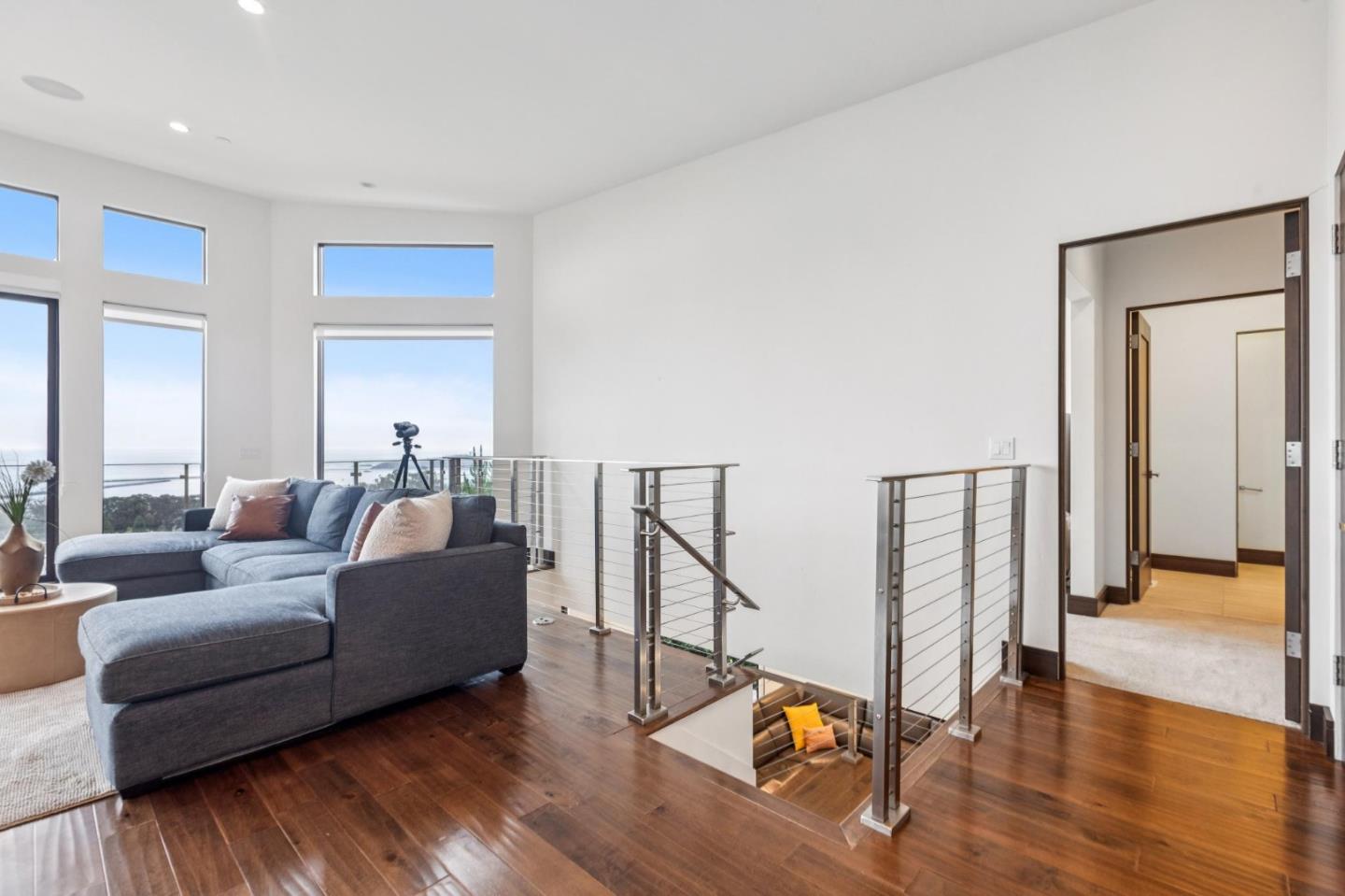 243 Del Monte Road El Granada, CA 94019 - Photo 35 of 66 a living room with furniture and a wooden floor