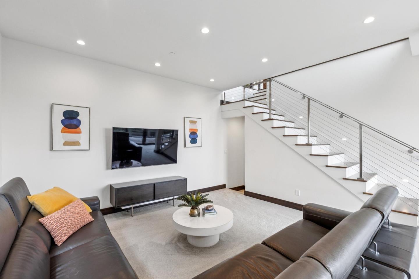243 Del Monte Road El Granada, CA 94019 - Photo 37 of 66 a living room with furniture and a flat screen tv