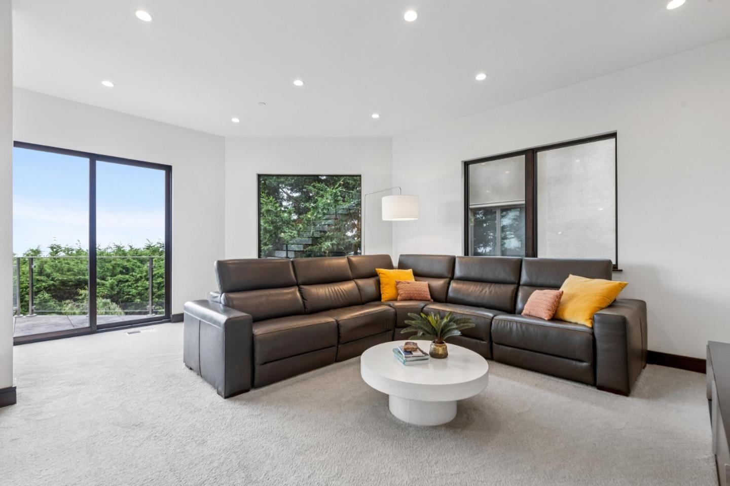243 Del Monte Road El Granada, CA 94019 - Photo 38 of 66 a living room with furniture and a large window