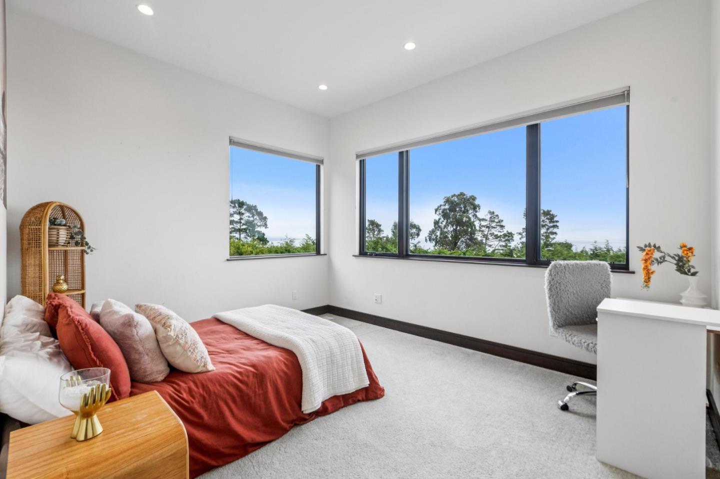 243 Del Monte Road El Granada, CA 94019 - Photo 43 of 66 a bedroom with furniture and a window