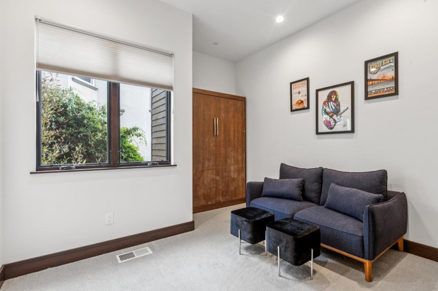 243 Del Monte Road El Granada, CA 94019 - Photo 48 of 66 a living room with furniture and a window