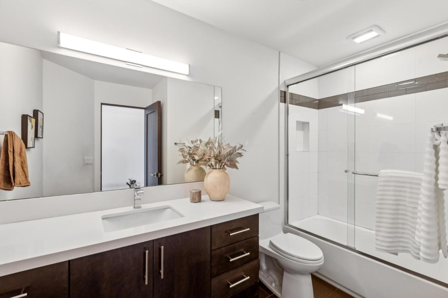 243 Del Monte Road El Granada, CA 94019 - Photo 50 of 66 a bathroom with a double vanity sink toilet and shower