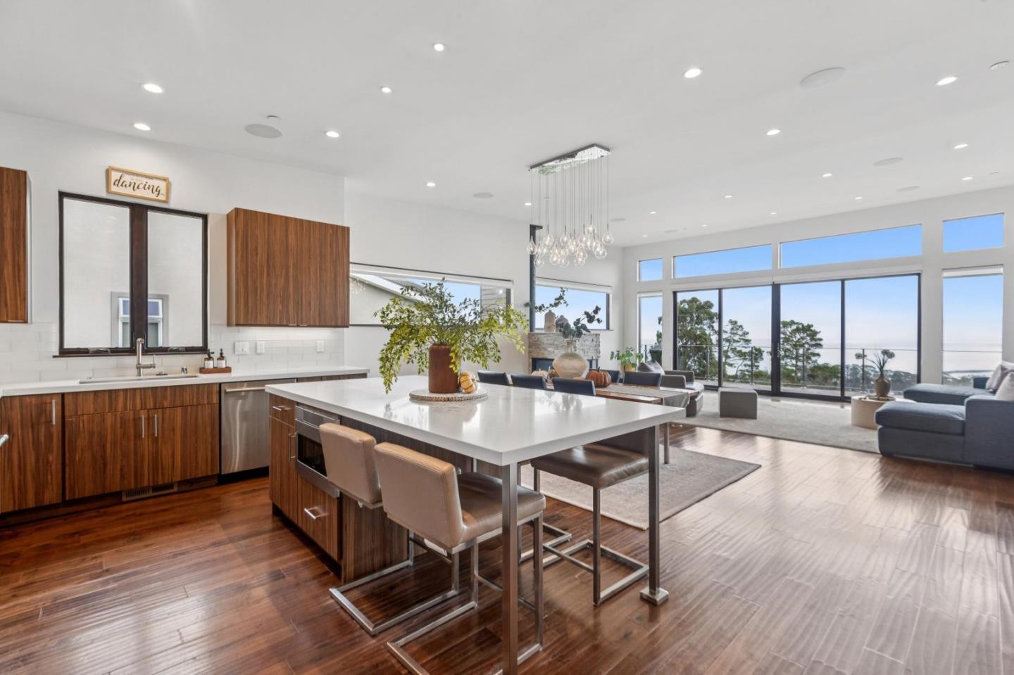 243 Del Monte Road El Granada, CA 94019 - Photo 5 of 66 a kitchen with sink cabinets and wooden floor