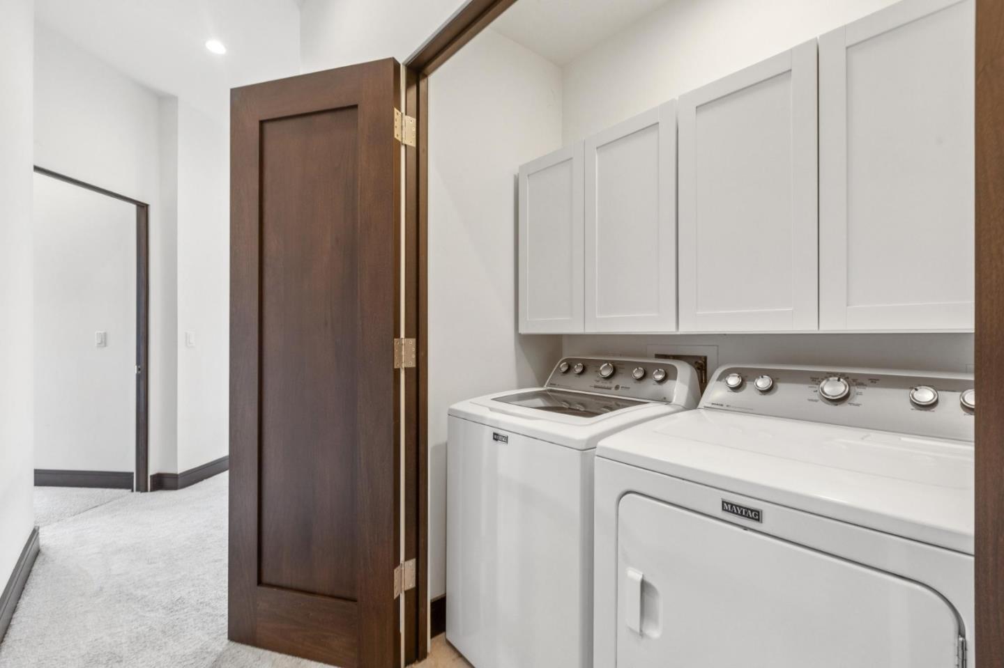 243 Del Monte Road El Granada, CA 94019 - Photo 53 of 66 a view of storage and utility room with washer and dryer
