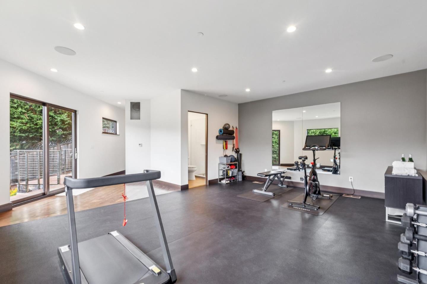 243 Del Monte Road El Granada, CA 94019 - Photo 55 of 66 a view of a room with gym equipment and floor to ceiling window