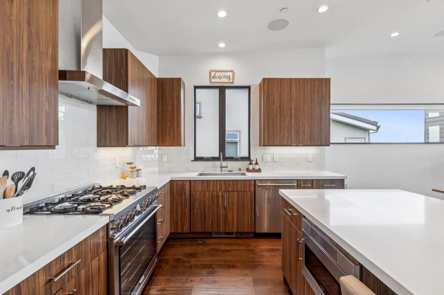 243 Del Monte Road El Granada, CA 94019 - Photo 6 of 66 a kitchen that has a sink and a stove