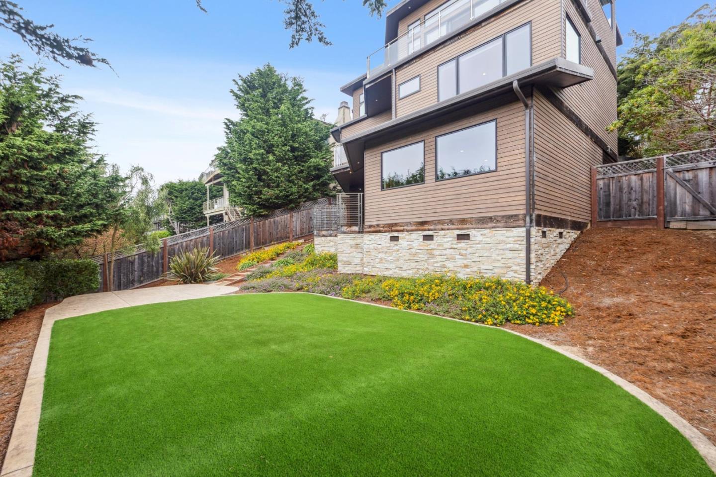 243 Del Monte Road El Granada, CA 94019 - Photo 63 of 66 a view of a house with a yard