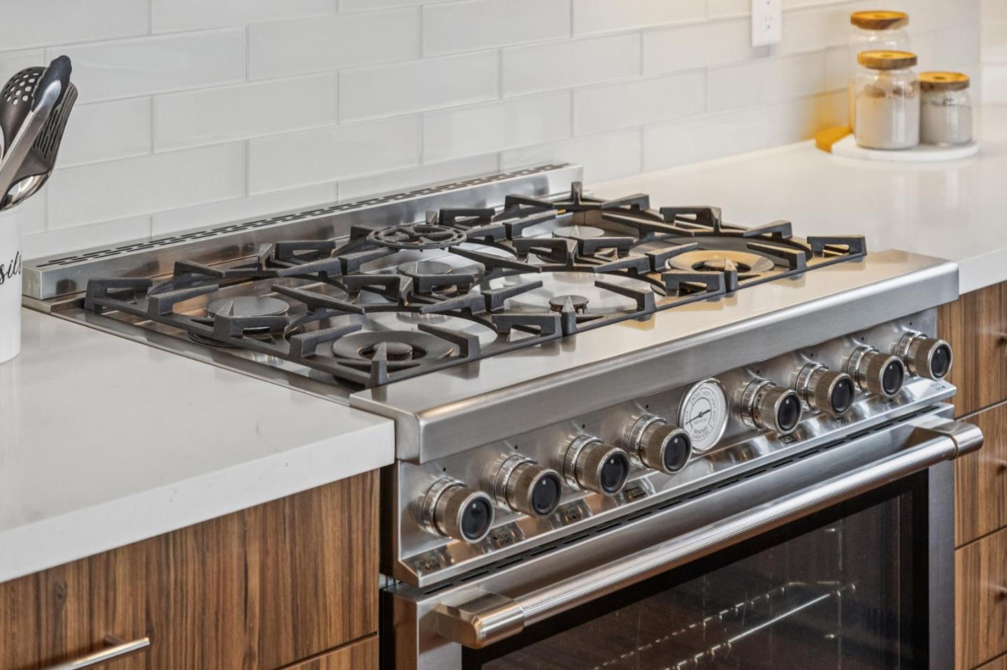 243 Del Monte Road El Granada, CA 94019 - Photo 7 of 66 a close up of a stove top oven sitting inside of a kitchen