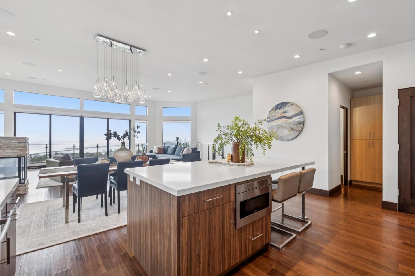 243 Del Monte Road El Granada, CA 94019 - Photo 8 of 66 a view of a dining room with furniture and wooden floor