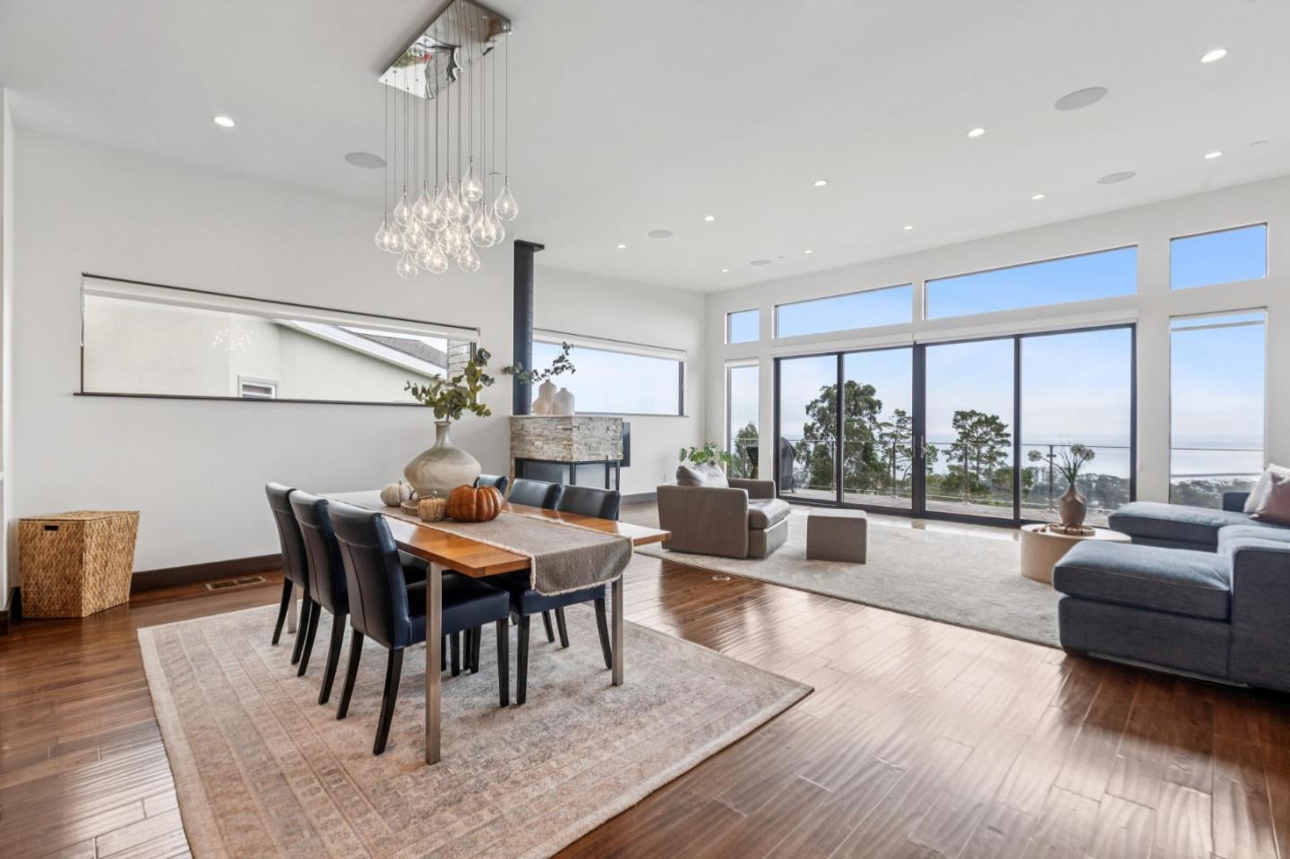 243 Del Monte Road El Granada, CA 94019 - Photo 9 of 66 a view of a dining room with furniture window and wooden floor