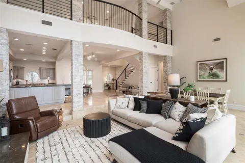 a bedroom with a large bed and a flat tv screen