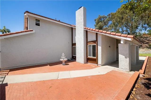 a front view of a house with a backyard space