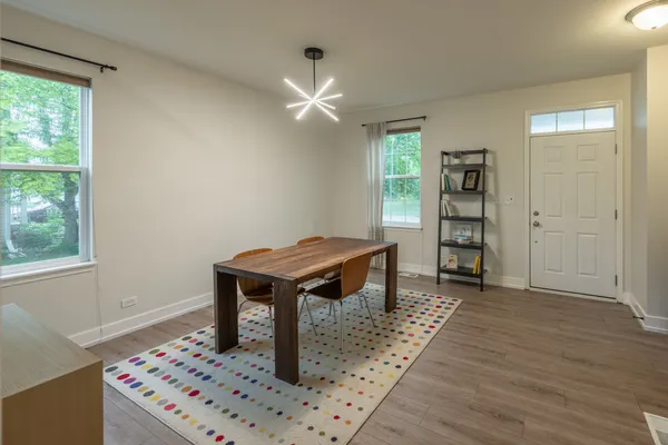 a room that has a bed and a table in it