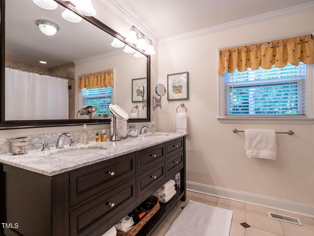 3510 Wordsworth Place Raleigh, NC 27609 - Photo 18 of 40 a bathroom with a granite countertop double vanity sink a mirror and a shower