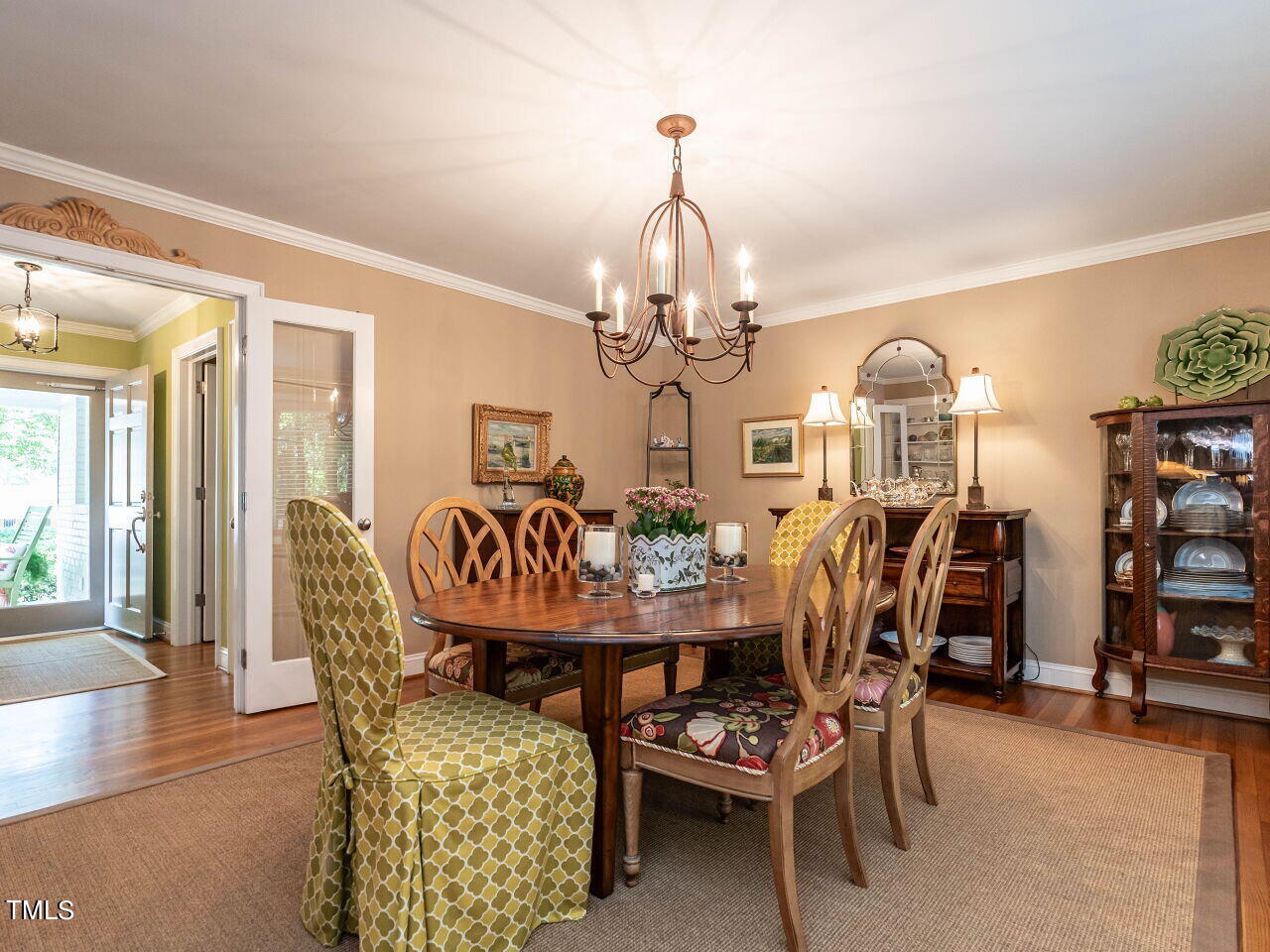 3510 Wordsworth Place Raleigh, NC 27609 - Photo 3 of 40 a view of a dining room with furniture and wooden floor