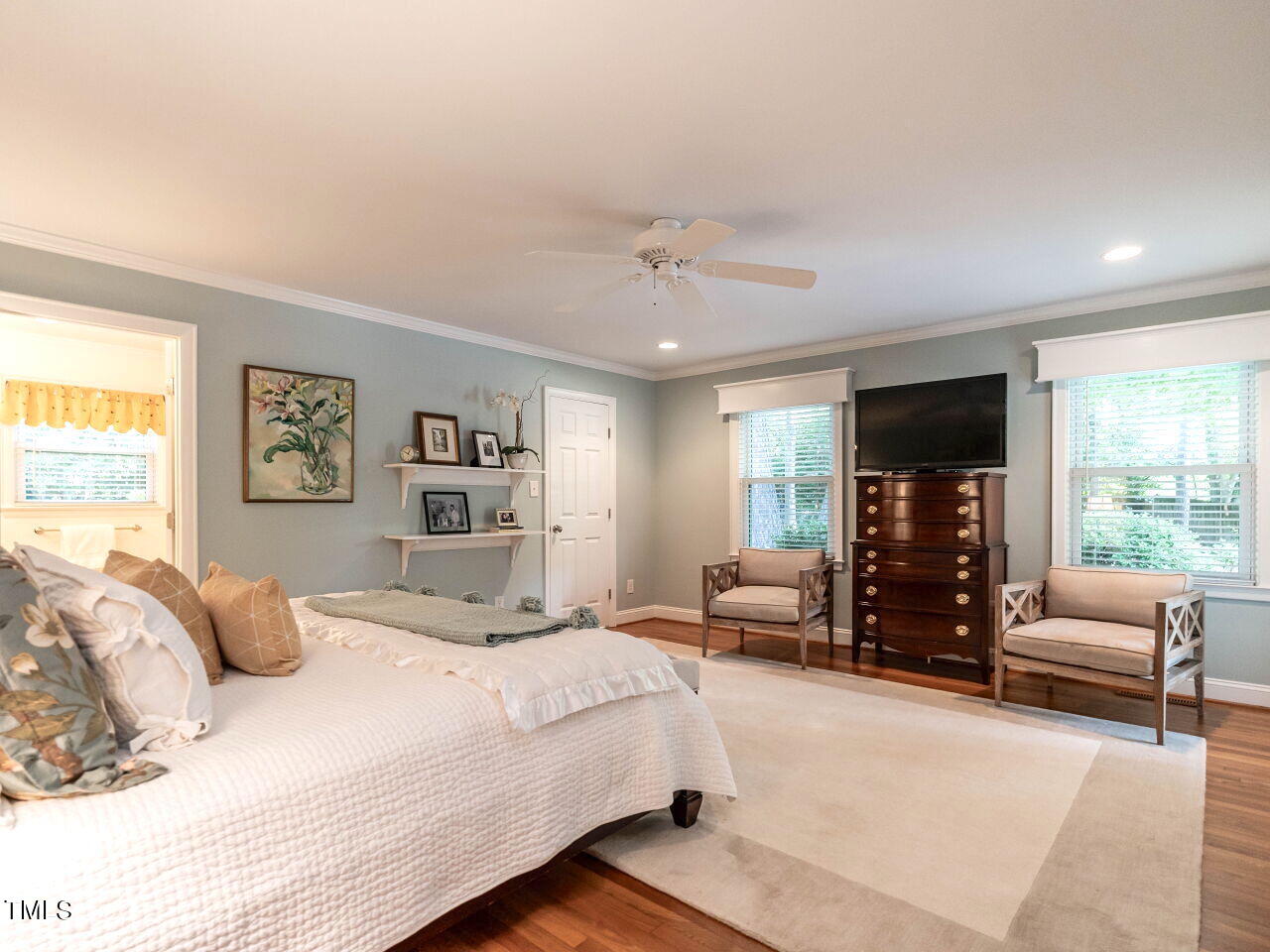 3510 Wordsworth Place Raleigh, NC 27609 - Photo 4 of 40 a bedroom with a large bed and a large window