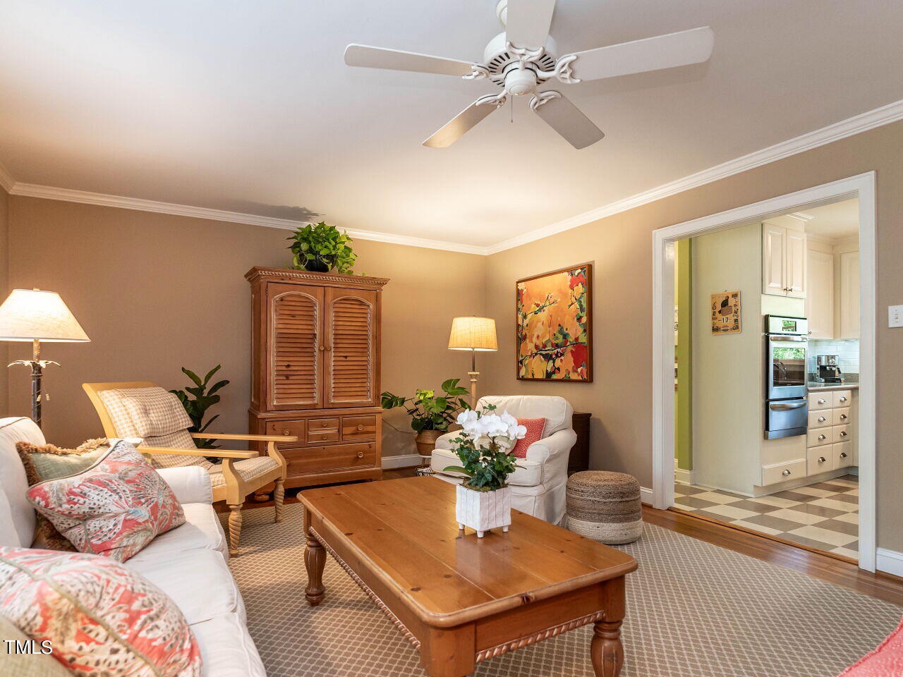 3510 Wordsworth Place Raleigh, NC 27609 - Photo 10 of 40 a living room with furniture flowers and a chandelier